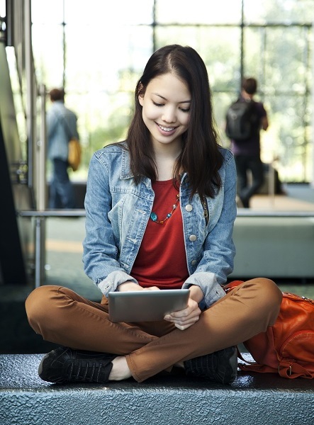 Close Learning Gaps Girl sitting with iPad